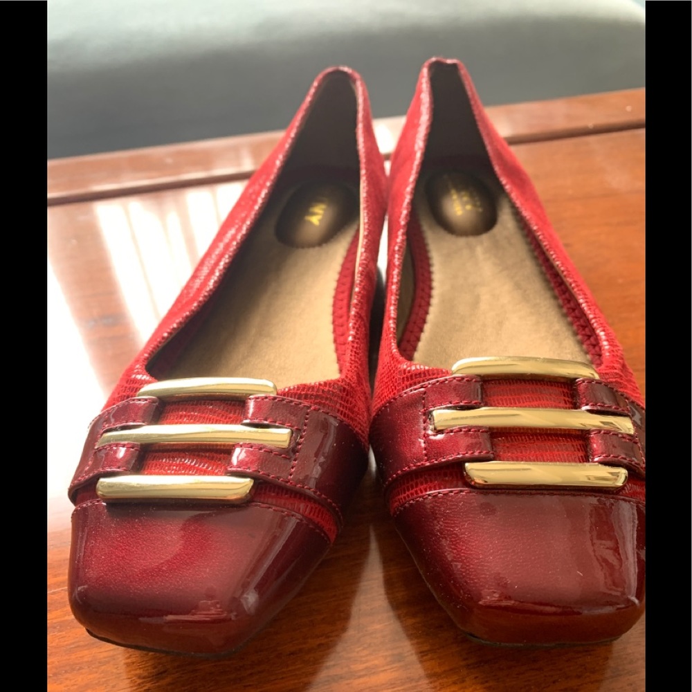 Red women’s flats with gold decoratives